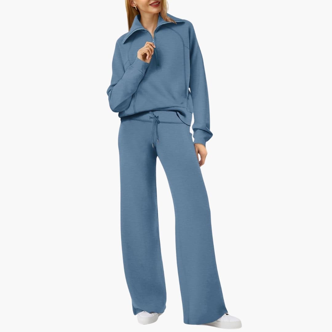 Relaxed fit women's lounge set with a half-zip top & wide-leg pants. Elegant two-piece for casual style.