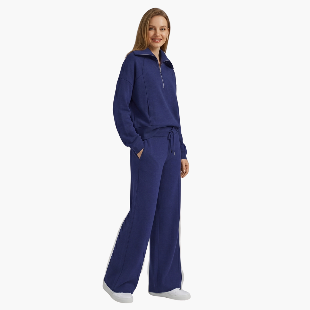 Black women's elegant lounge set with a half-zip top & comfortable wide-leg pants. Ideal for casual wear.