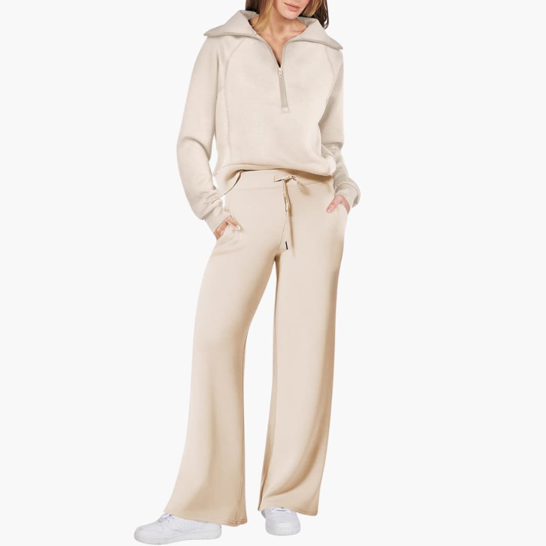 Women's two-piece set for loungewear. Half-zip top & wide-leg drawstring pants. Cozy & stylish travel outfit.