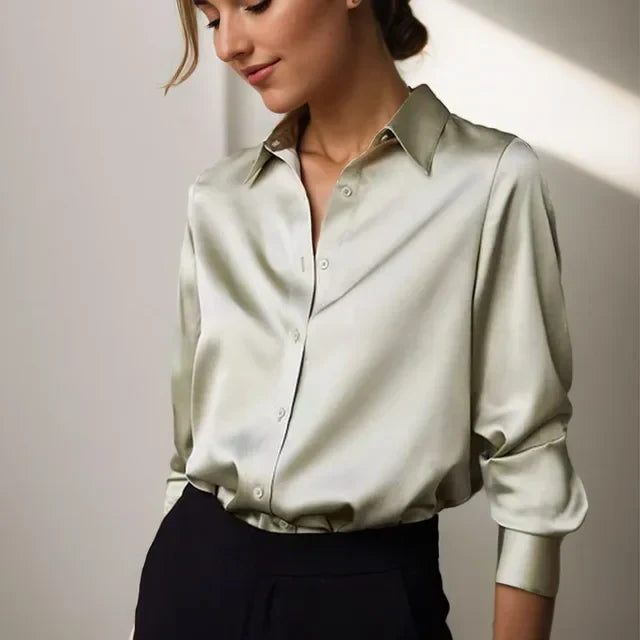 Elegant women's silky loose-fit button-up blouse with long sleeves, perfect for office or casual chic wear.