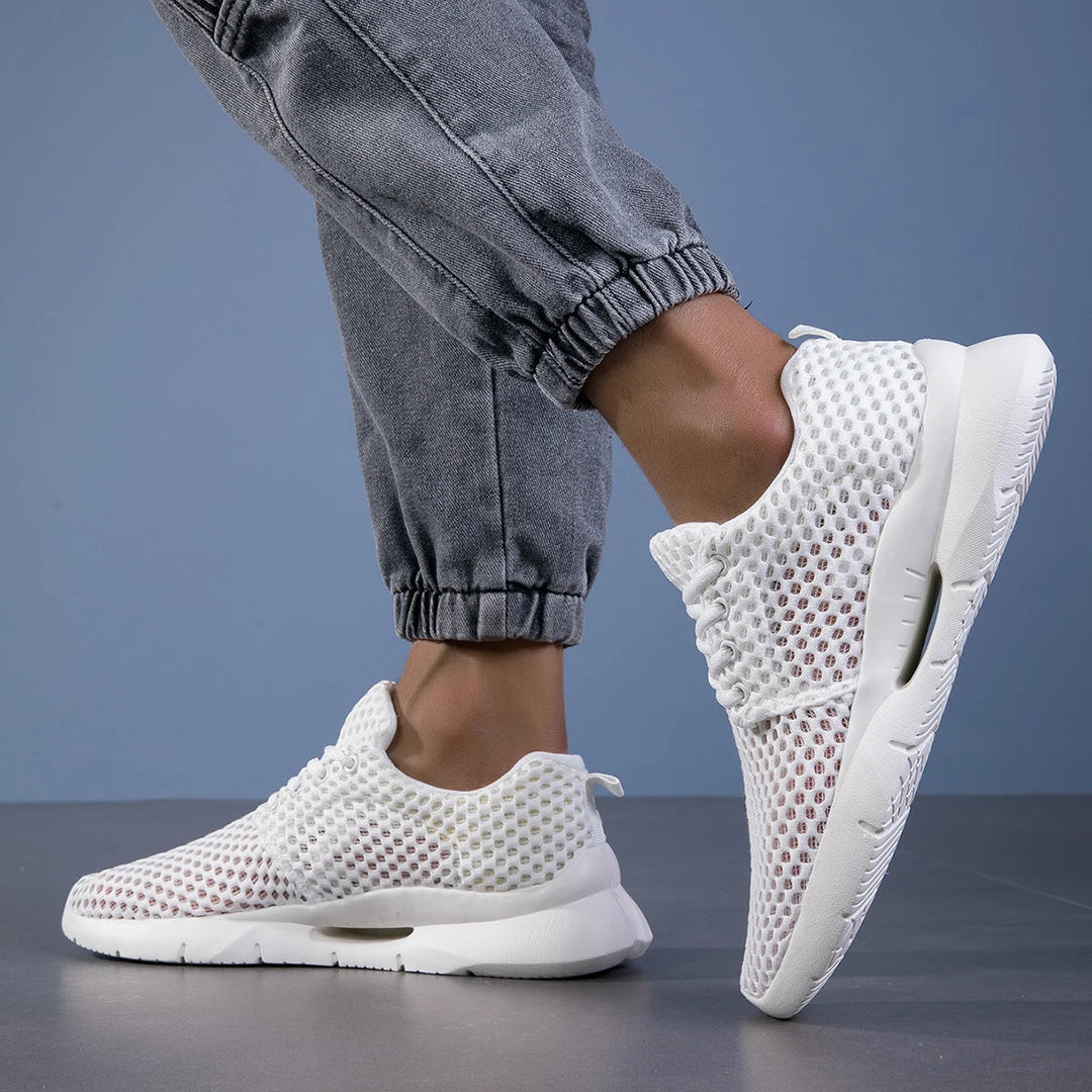 Side view of Jaslyn breathable footwear, showcasing its sleek design and supportive structure.