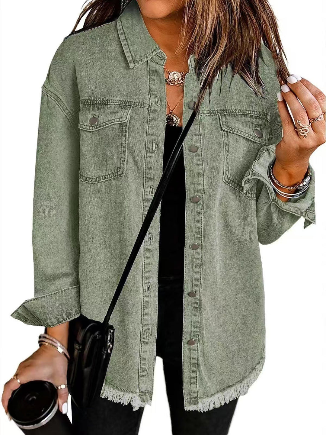 Oversized women's longline denim shacket with button-down front. Trendy casual layering piece.
