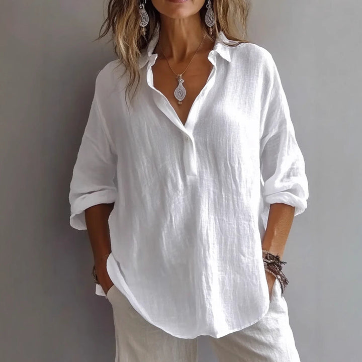 Relaxed fit women's top, a casual blouse with fashionable wide sleeves & button placket.