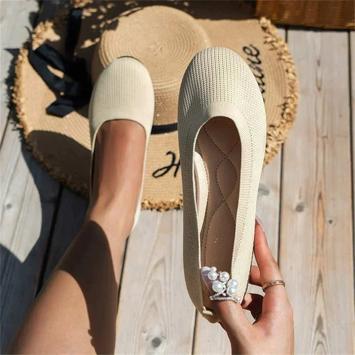 Profile view of women's supportive ballet flats with cushioned arch for comfort and pain relief.