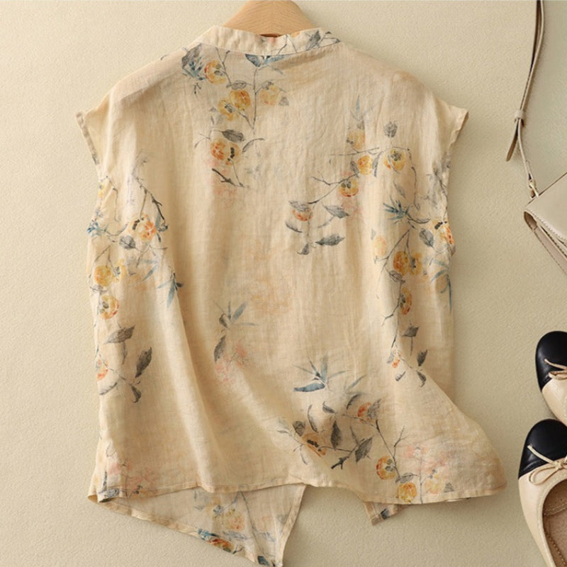 Feminine floral print sleeveless top for women, featuring a stylish mandarin collar. Perfect for warm summer days.