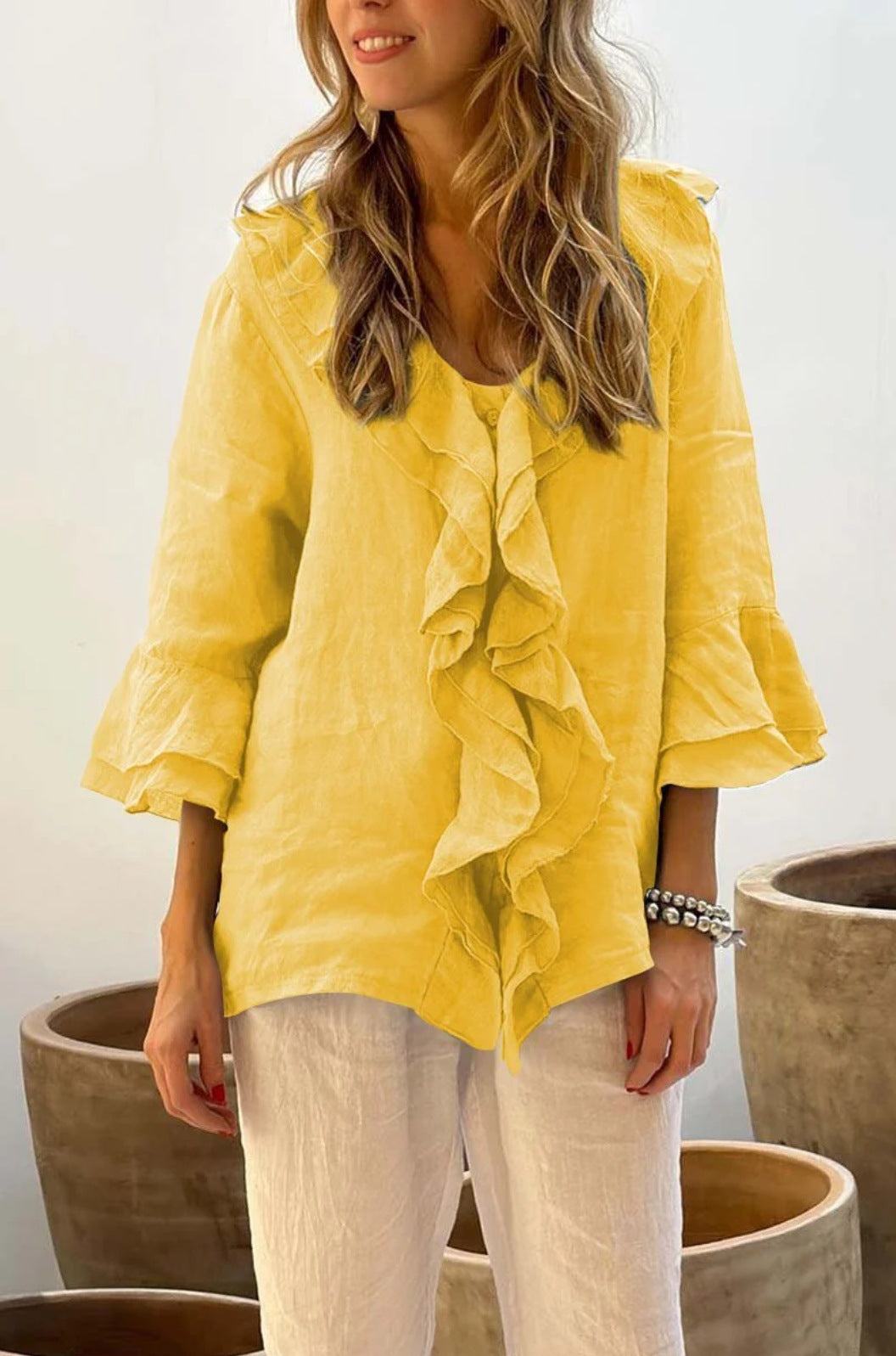 Versatile women's 3/4 sleeve ruffled top, designed for effortless style and a perfect fit for daily wear.