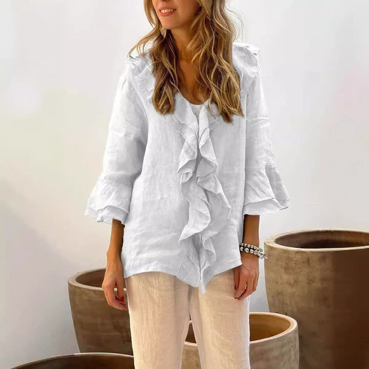 Fashionable women's ruffled blouse featuring 3/4 sleeves, ideal for effortless spring fashion and summer comfort.