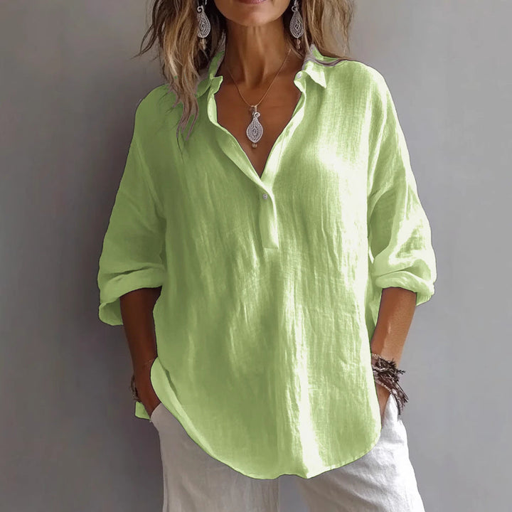 Modern chic women's wide sleeve blouse with button placket, perfect for a versatile wardrobe.