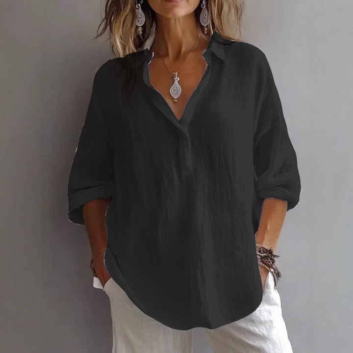 Elegant women's button placket top with wide sleeves & relaxed fit for everyday wear.