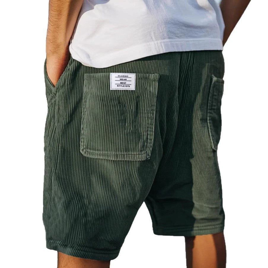 Stylish men's tailored shorts for a refined yet casual look, featuring a subtle, fashionable texture.