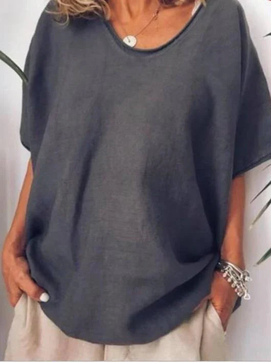 Women's relaxed blouse: oversized V-neck t-shirt with dropped shoulders, comfortable for casual style.