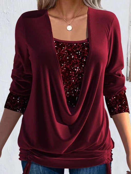 Close-up of a shimmering women's long sleeve sequin blouse, highlighting the exquisite sparkle and detail.