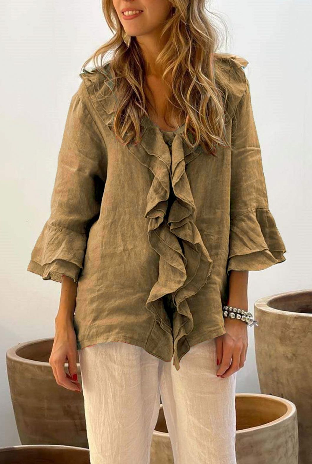 Women's summer shirt with ruffles and 3/4 sleeves, providing a relaxed fit and chic style for everyday fashion.