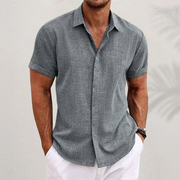 Detail of collar and buttons on a men's short sleeve classic button-up shirt, ideal for summer wear.