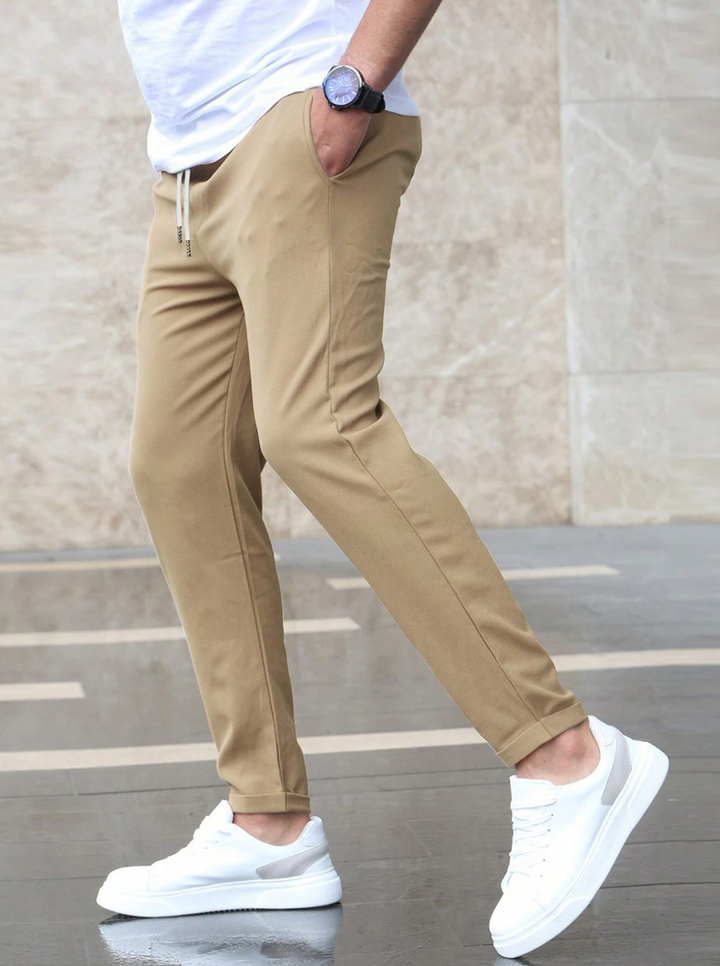 Wrinkle-resistant men's stretch pants, ideal for easy-care smart casual and office wear.