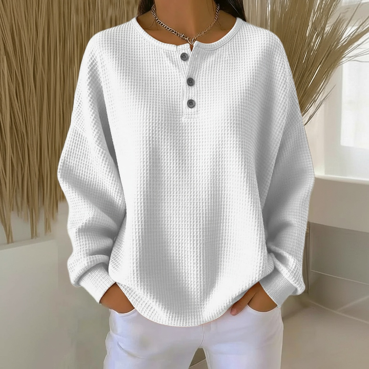 Textured waffle knit women's top with button-front & drop shoulder for cozy, relaxed style.
