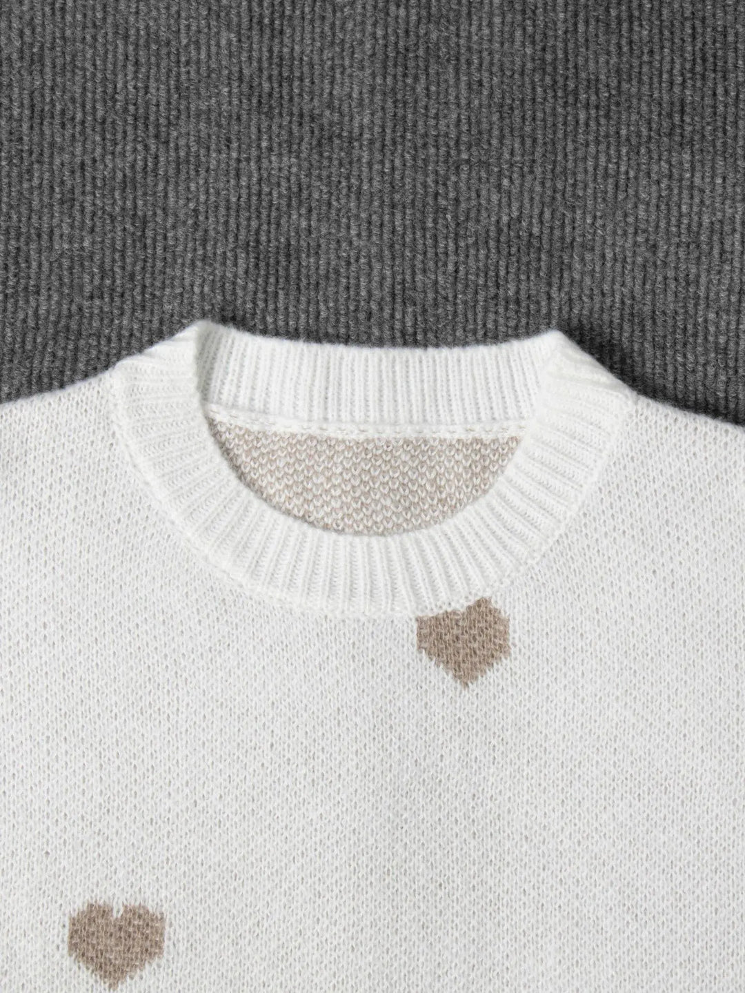 Cozy women's oversized sweater with adorable heart embroidery, puff sleeves for winter comfort.