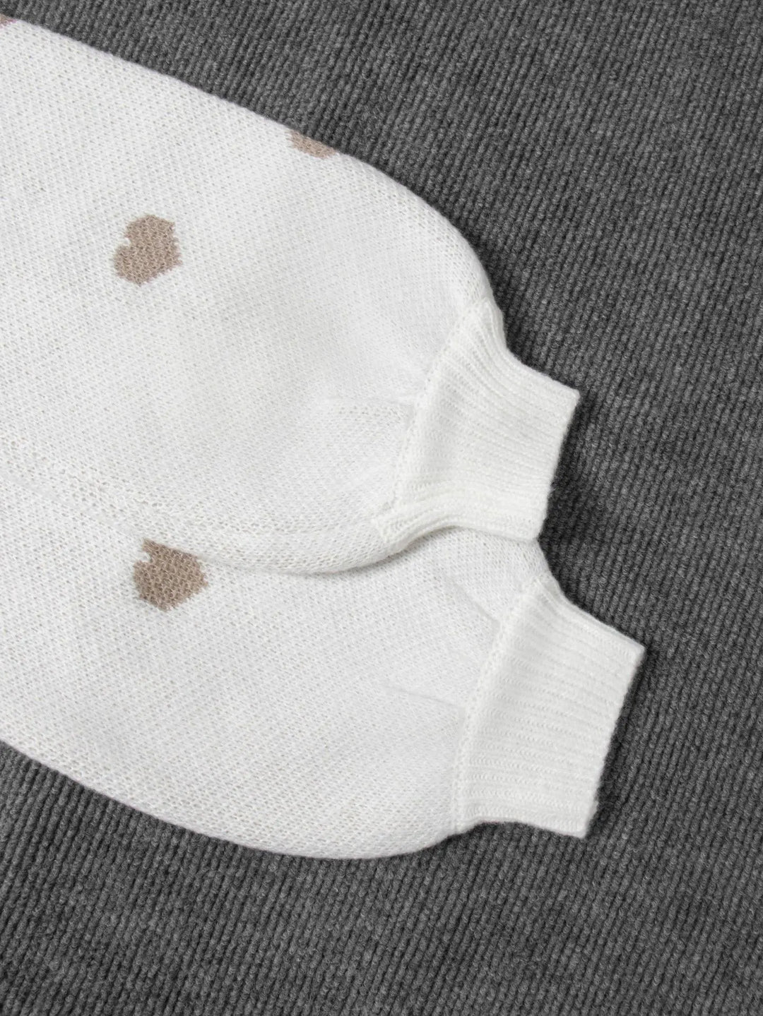 Women's casual oversized jumper featuring a charming embroidered heart design on the chest.