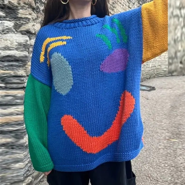 Stylish women's oversized smiley face fall sweater, a trendy long sleeve knit for cozy autumn outfits.