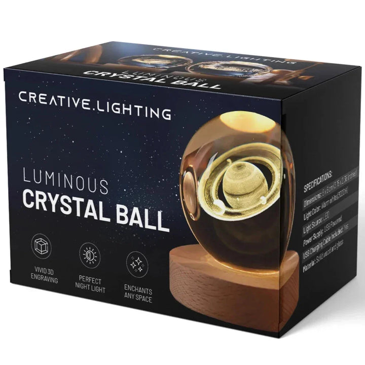 Glowing 3D galaxy crystal ball lamp on a wooden base. Unique LED night light and space-themed desk decor.