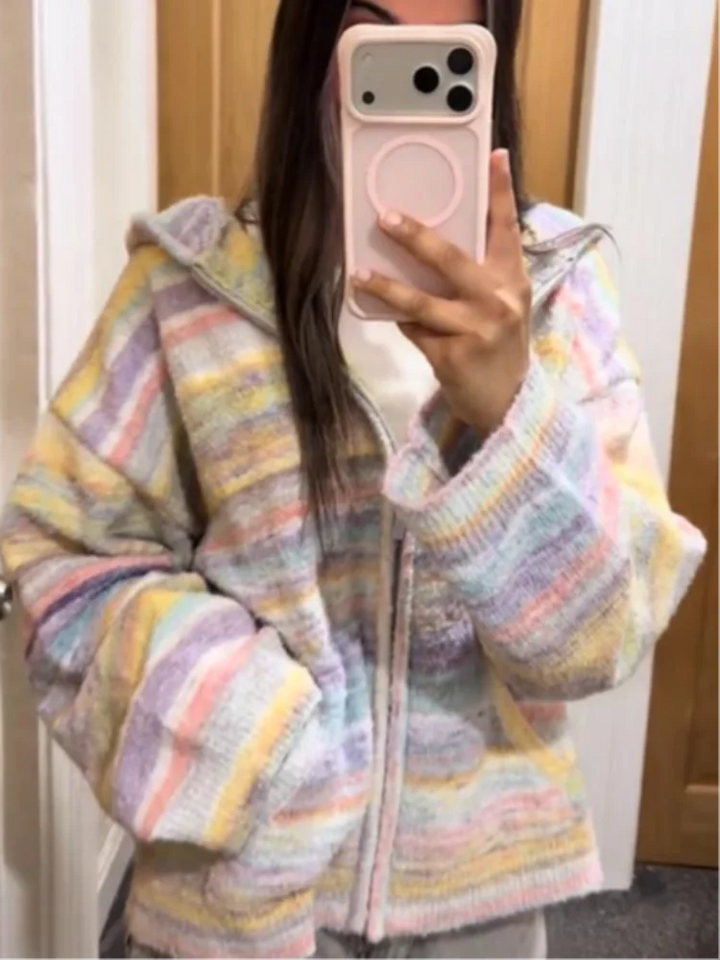 Women's cozy pastel striped zip-up jacket for casual wear.