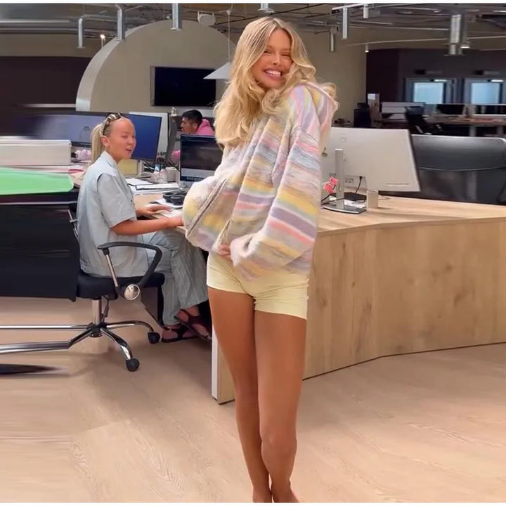 Zip-up women's jacket with multi-colored pastel stripes.