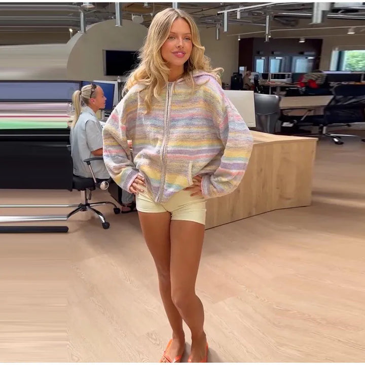 Stylish women's pastel striped zip-up for versatile casual looks.