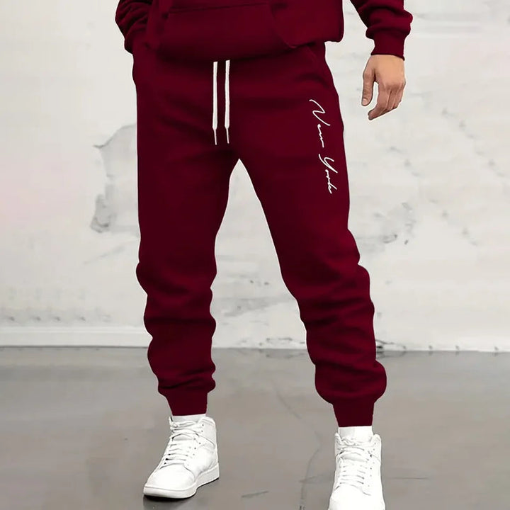 Versatile men's jogger sweatpants with elastic waist & drawstring closure for active sports & casual wear.