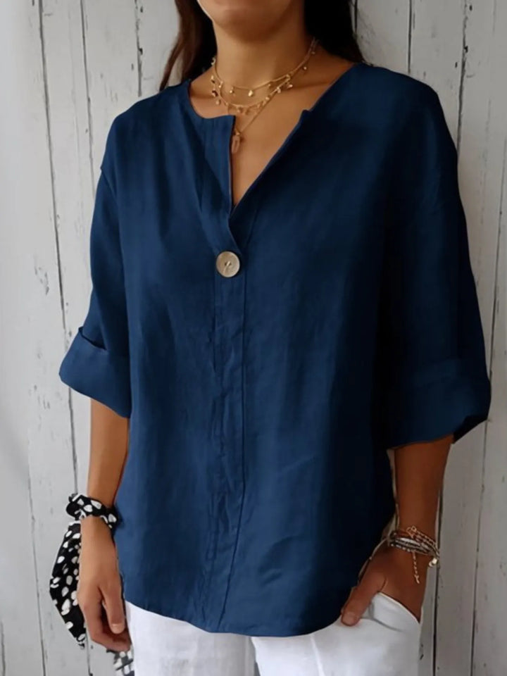 Front view of a women's casual drop shoulder blouse, relaxed fit, button-down for versatile styling.