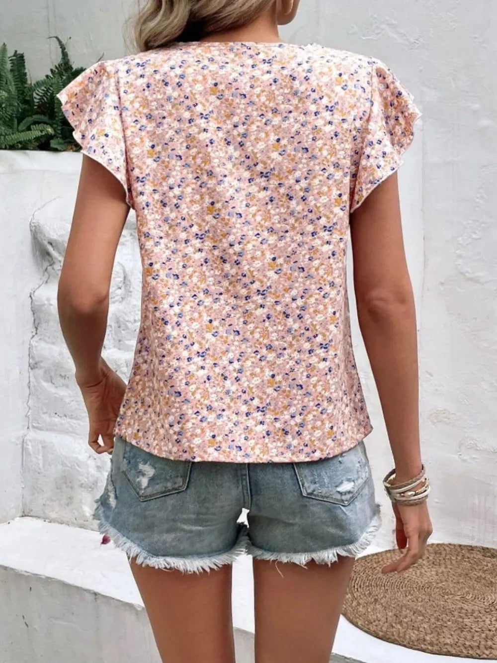 Casual women's ruffle sleeve blouse, adorned with a pretty floral print, great for everyday comfort.