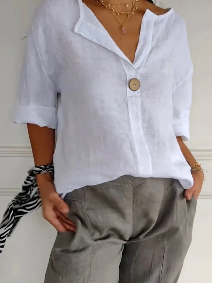Full view of a women's simple style drop shoulder blouse, a comfortable, versatile casual top for everyday.