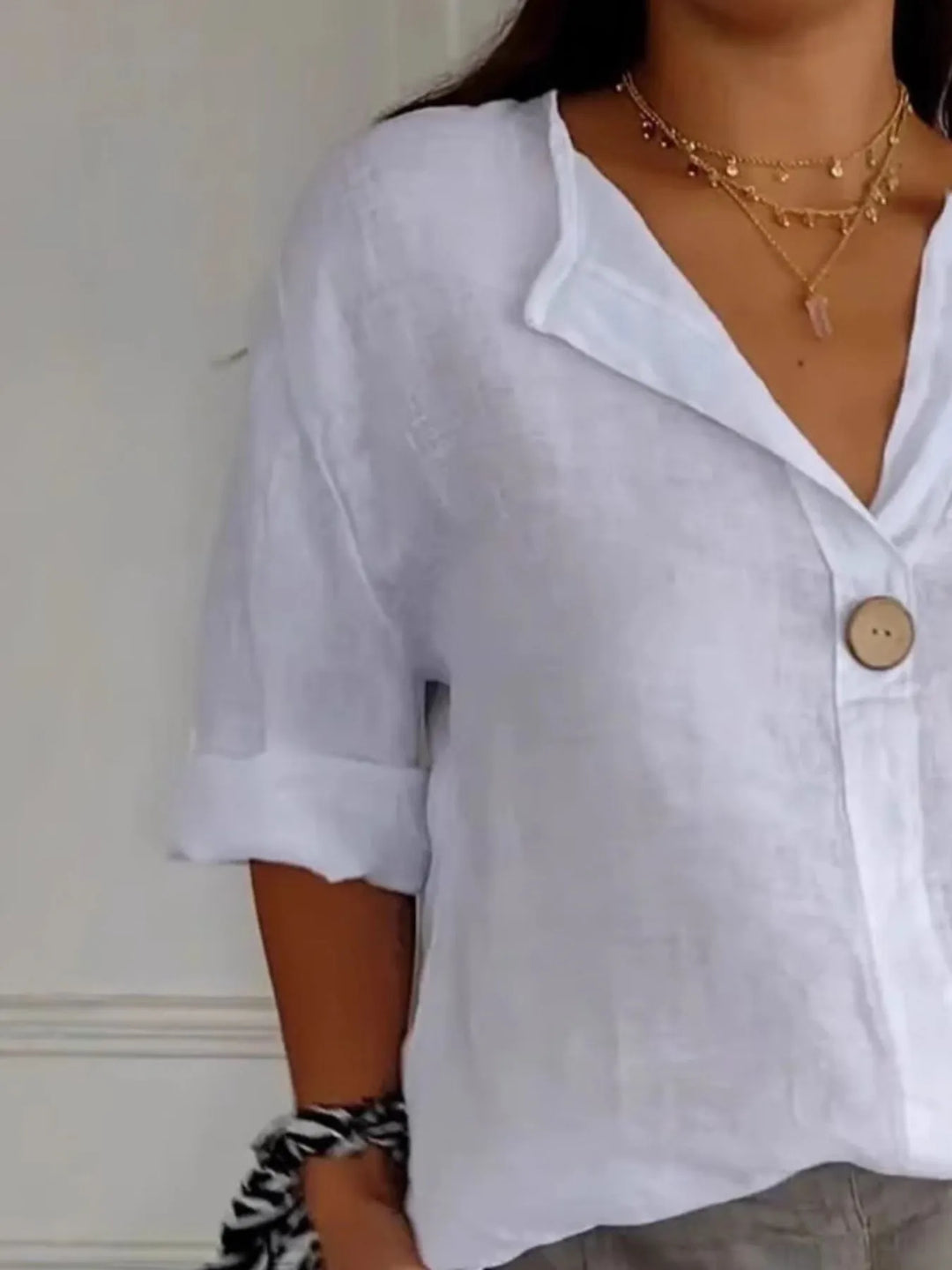 Comfortable women's casual drop shoulder blouse with a relaxed fit. Simple, versatile button-down everyday top.