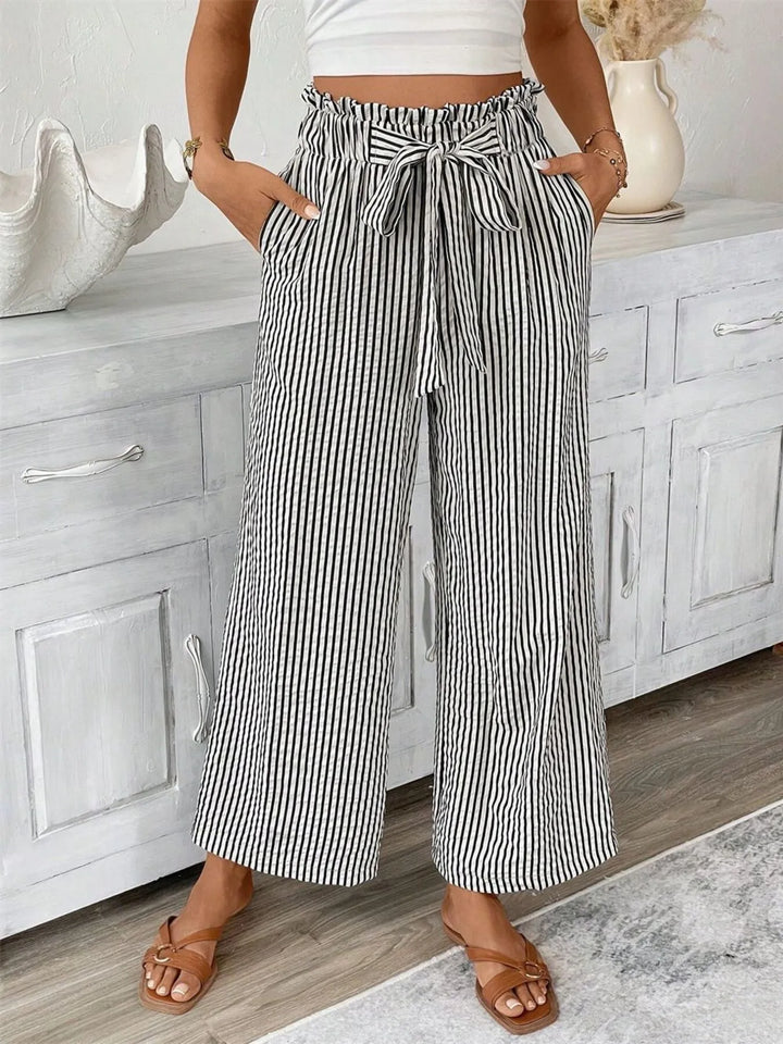 Women's striped paperbag waist wide leg pants, perfect for a casual summer look.