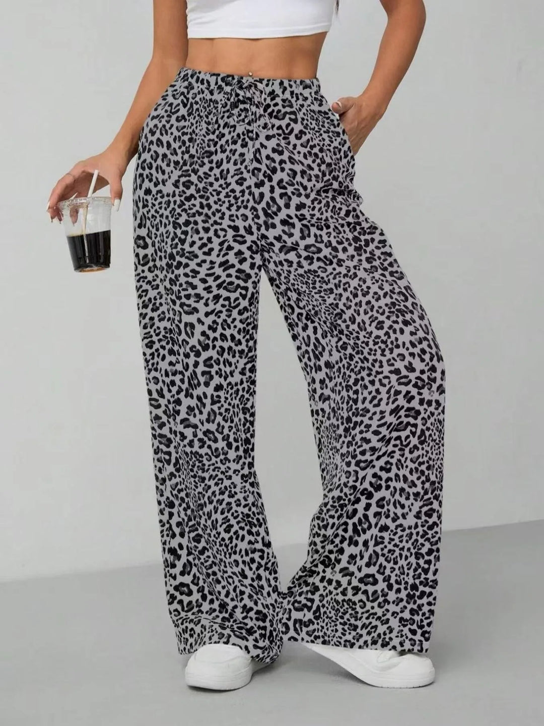 Effortless chic women's leopard print wide leg pants, with a practical drawstring waist for comfort.