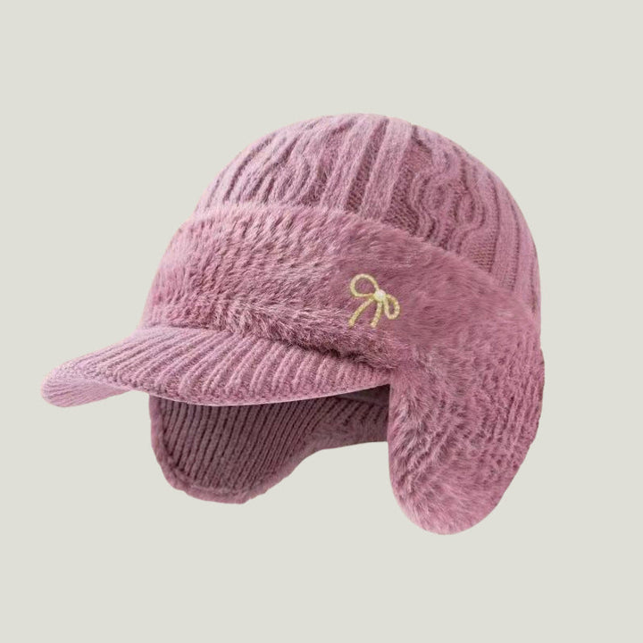 Comfortable and warm trapper hat with fleece-lined ear flaps, perfect for any cold weather outing.