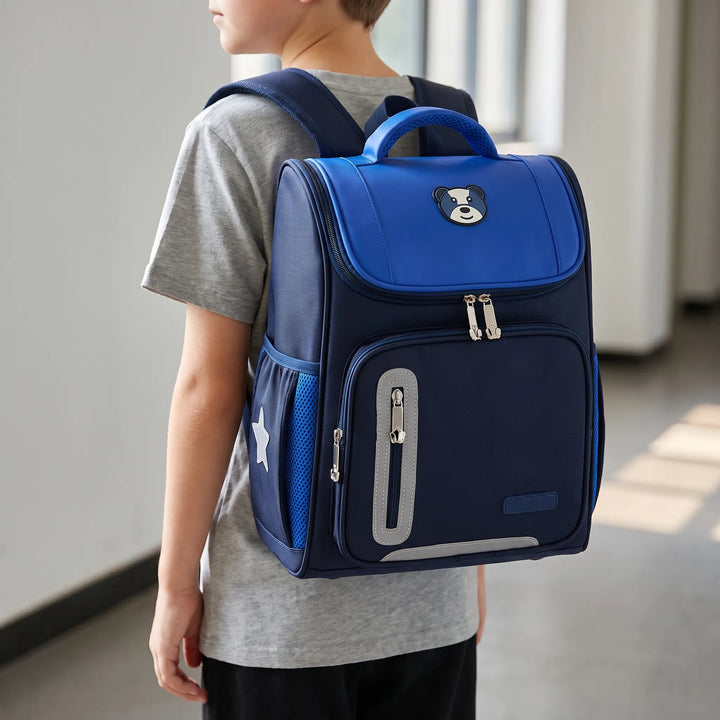 Kids' primary school backpack with cute bear motif, durable & water-resistant, ideal for boys & girls.