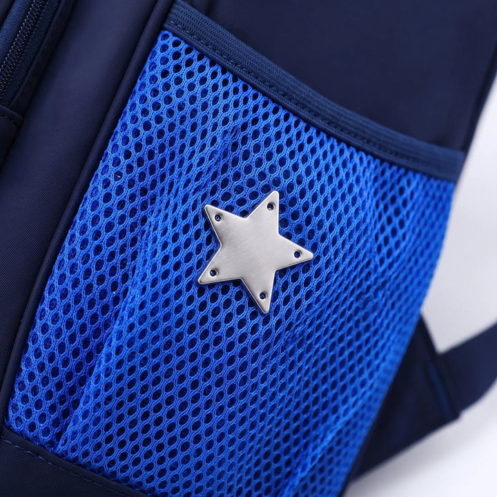 Adorable bear motif on a blue primary school backpack, featuring durable fabric; perfect for young students.