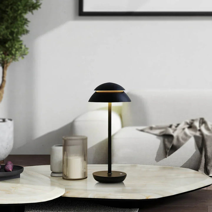 Close-up of dimmable Nordic LED table lamp with touch controls, sleek aluminum finish, rechargeable & portable.