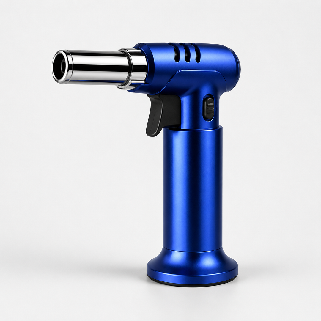 Compact refillable butane culinary torch, perfect baking tool for caramelizing desserts.