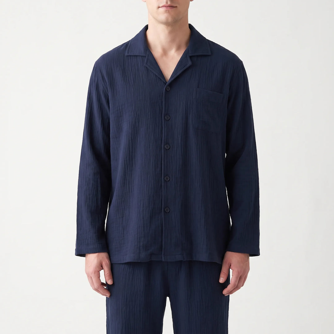 Folded men's relaxed fit long sleeve pyjama set, showcasing soft fabric and comfort for sleep.