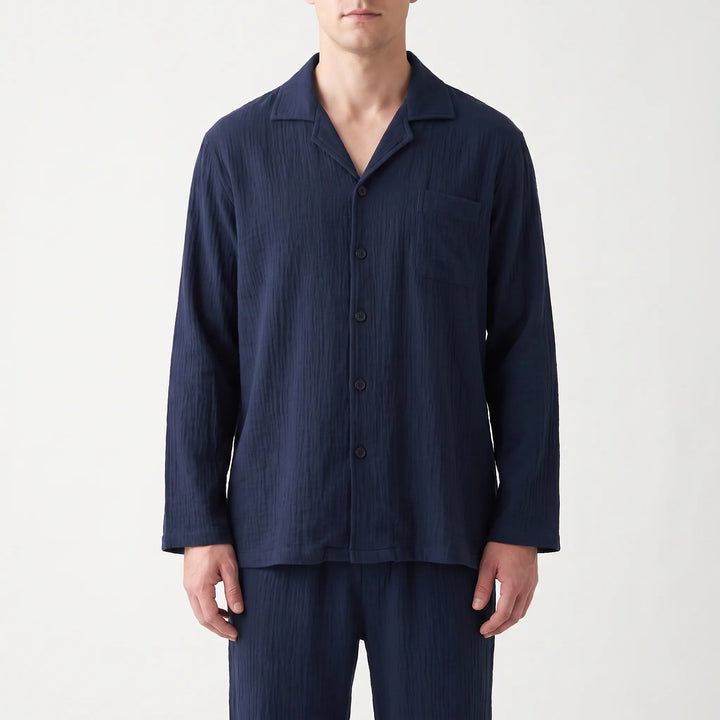Folded men's relaxed fit long sleeve pyjama set, showcasing soft fabric and comfort for sleep.