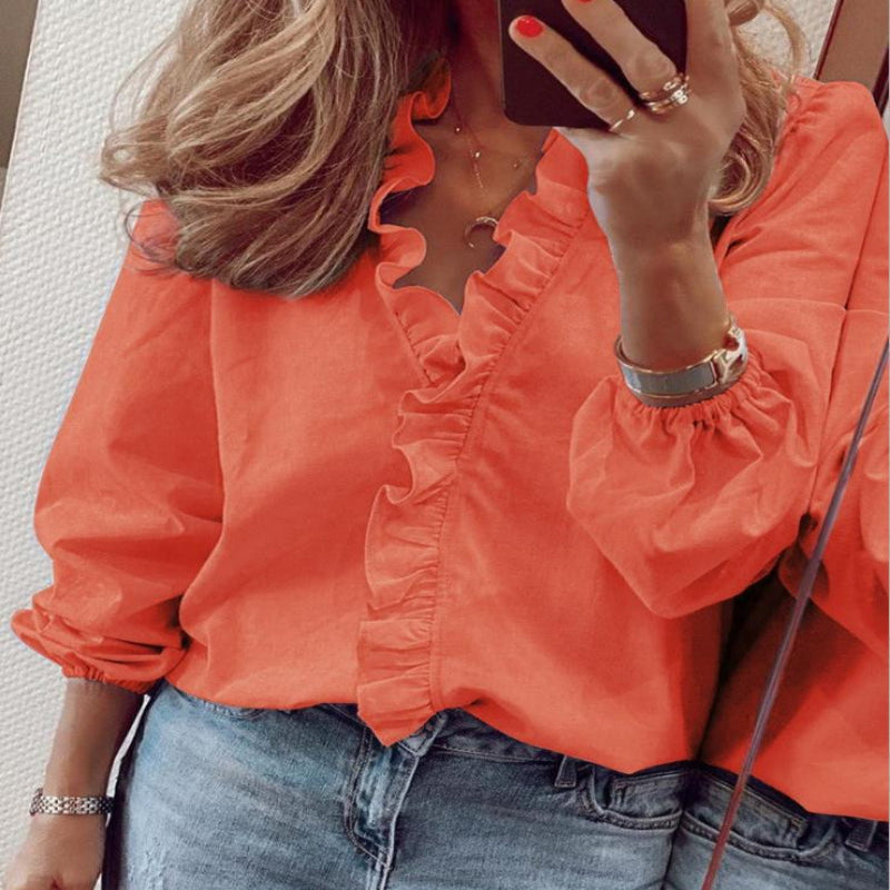 Delicate ruffle V-neck women's blouse in a comfortable loose fit, perfect for elegant spring, summer, or fall fashion.