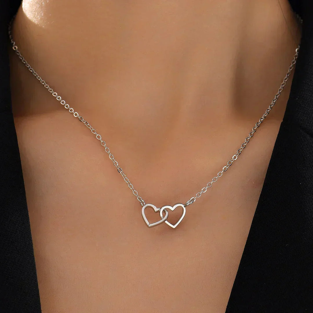 Delicate gold vermeil interlocking heart pendant necklace, women's sterling silver jewelry perfect for elegant style.