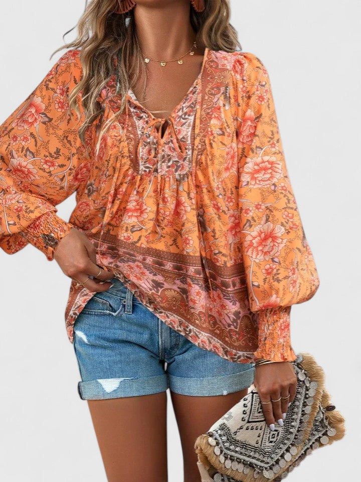 Women's boho V-neck lace-up blouse, flowy long sleeve paisley print top. Casual spring/summer fashion.
