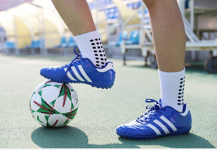 Unisex sports socks, mid-calf length, featuring anti-slip pads for ultimate grip and support in training.