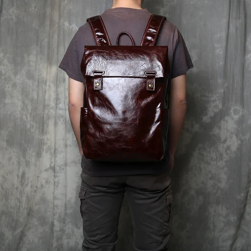 Professional men's leather laptop bag, stylish and durable, with organized compartments for work essentials.