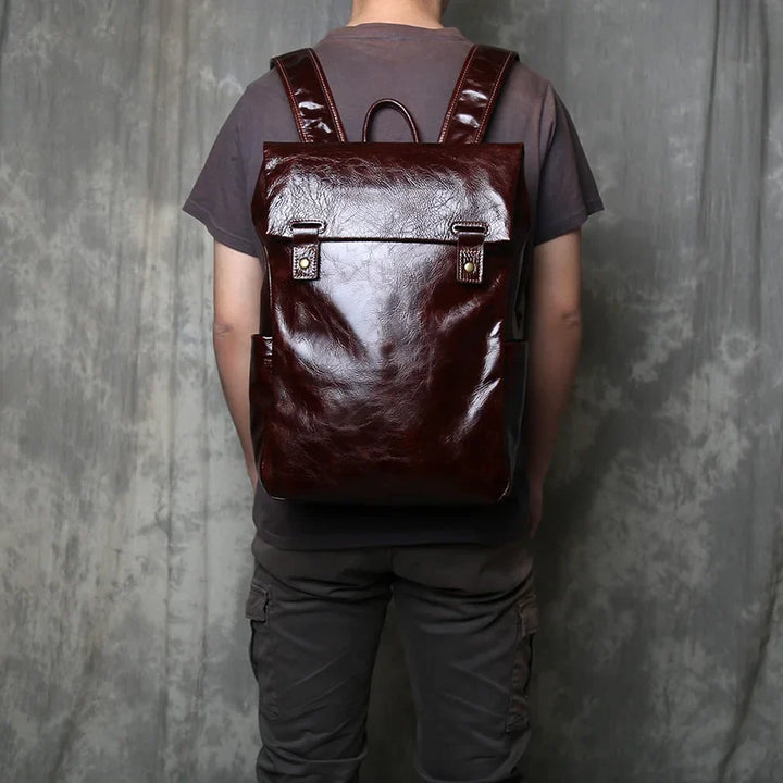 Professional men's leather laptop bag, stylish and durable, with organized compartments for work essentials.