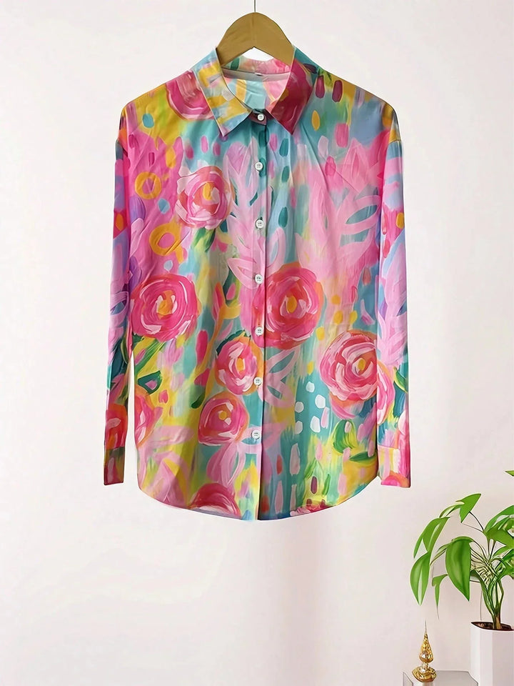 Abstract print women's long sleeve blouse. Button-front, collared top with a vibrant pattern for casual wear.