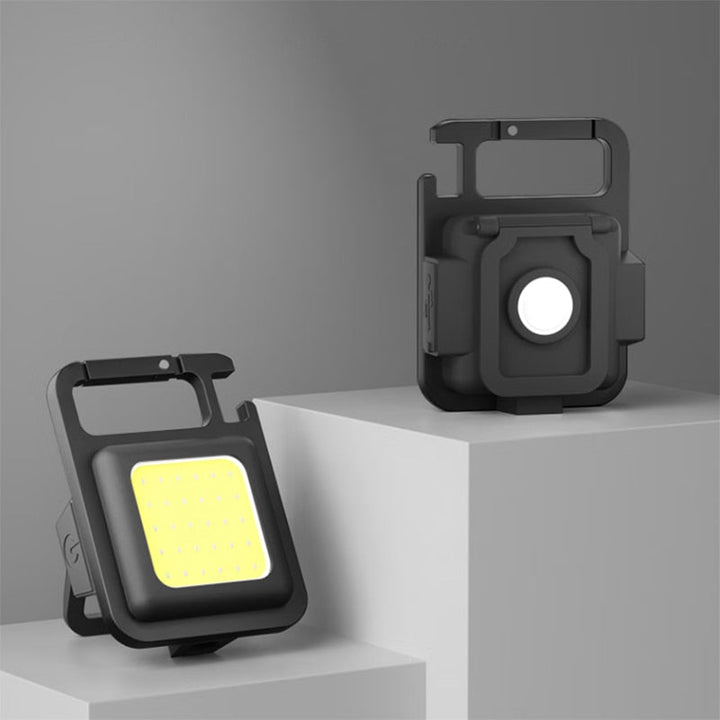 Compact rechargeable LED keychain flashlight & multi-tool, perfect for EDC, camping, and emergency use.
