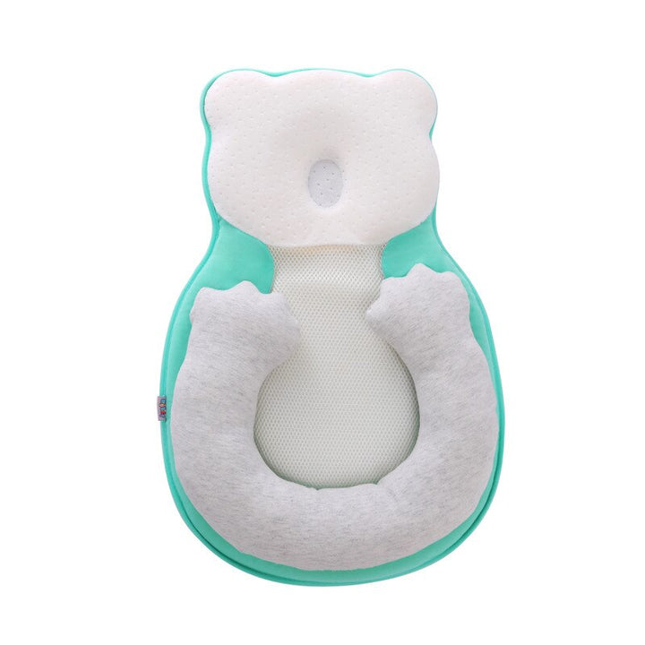 Infant positioning pillow for newborns, featuring adjustable leg support to aid colic relief & comfort.